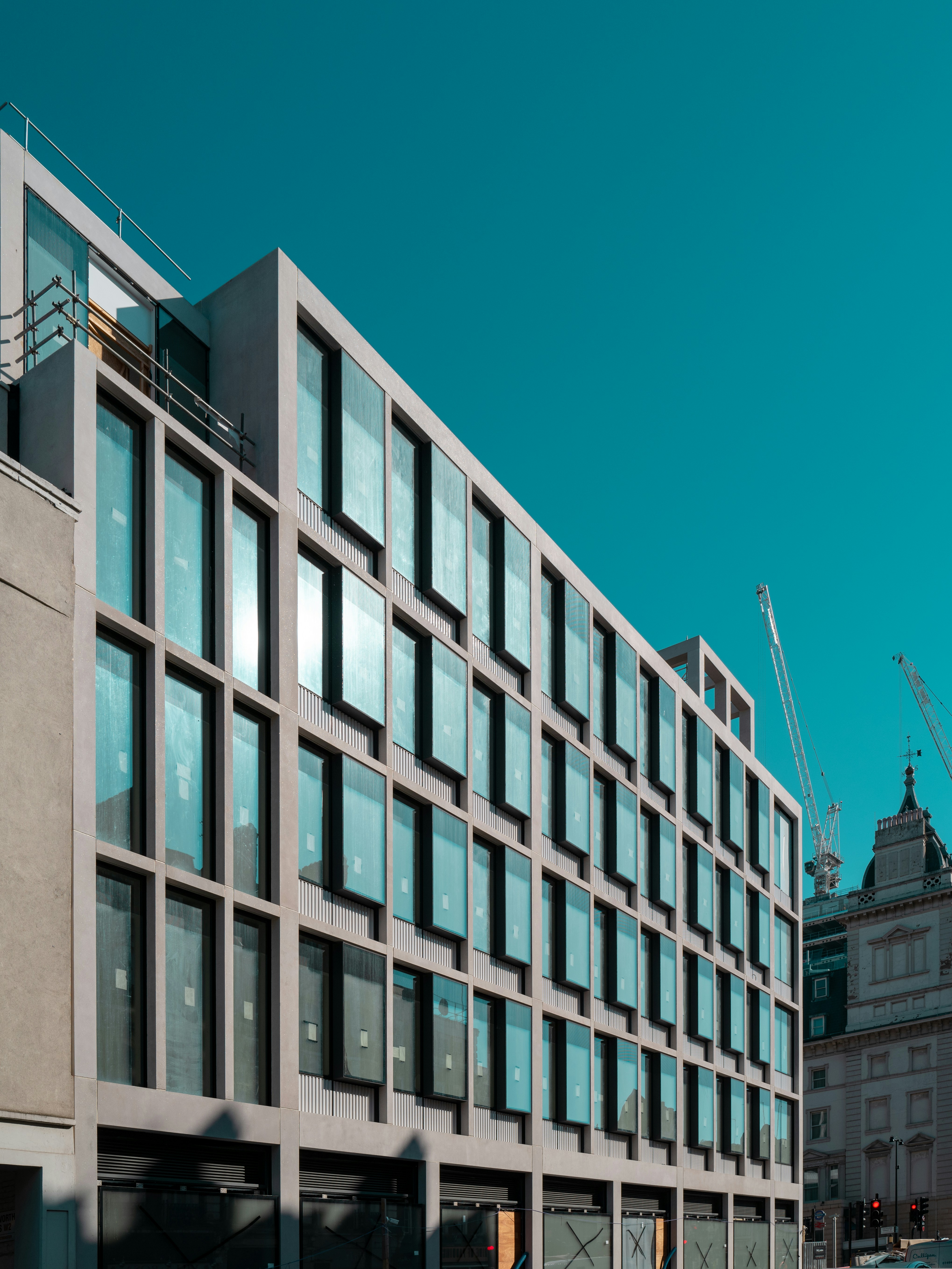 white and brown concrete building under blue sky during daytime