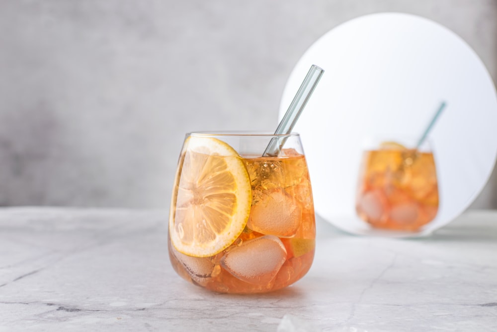 sliced orange fruit on white table