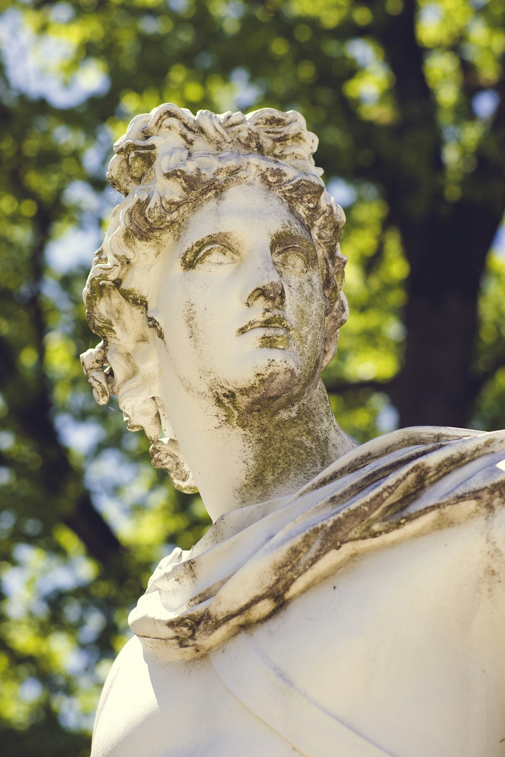 white concrete statue of woman