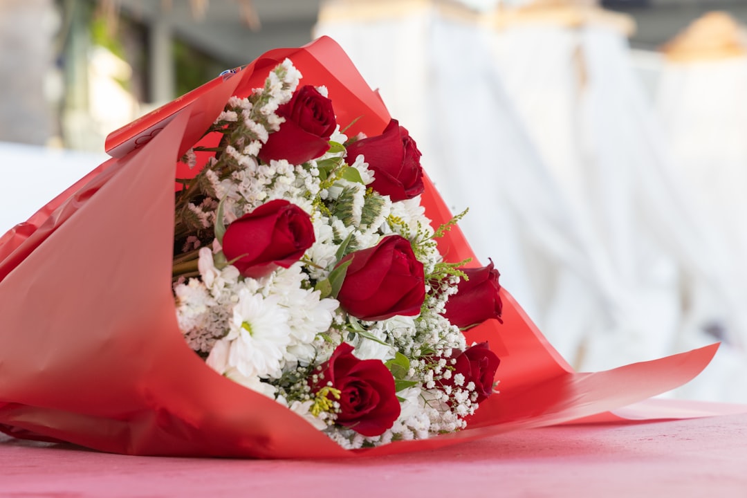 white and red flowers on red box