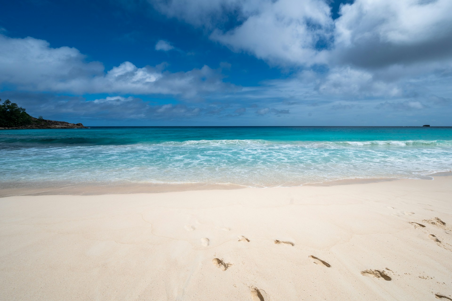 white sand beach under blue sky during daytime