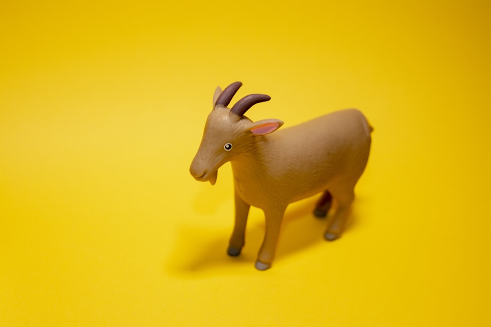 yellow and black animal plastic toy