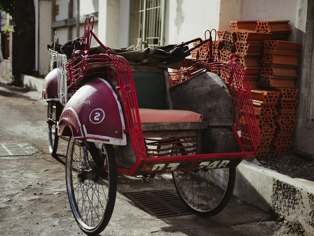 red and black bicycle on gray concrete floor