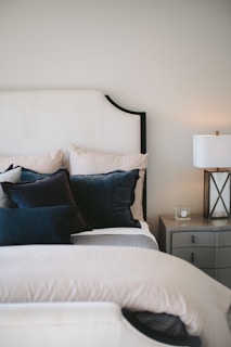 black and white bed pillows on bed