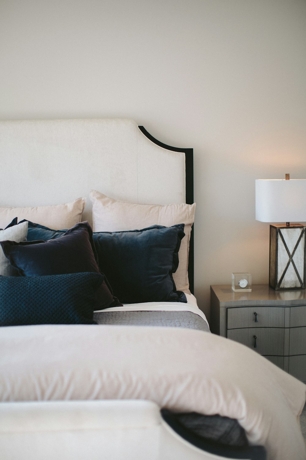 black and white bed pillows on bed