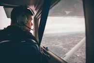 person in black jacket wearing black headphones