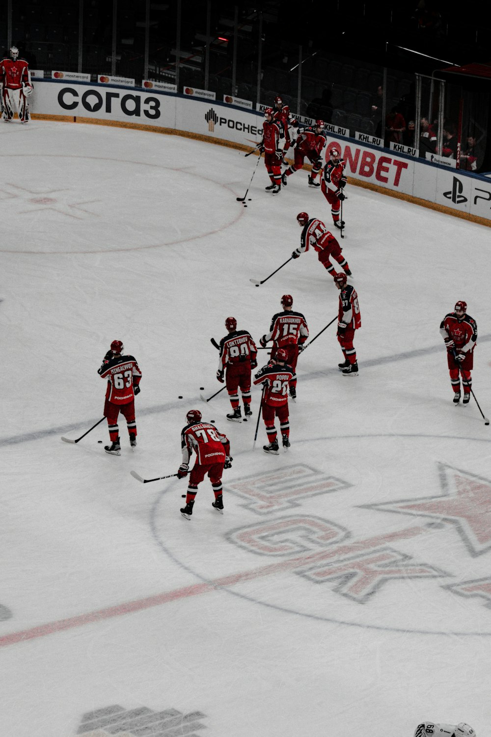 group of men playing ice hockey