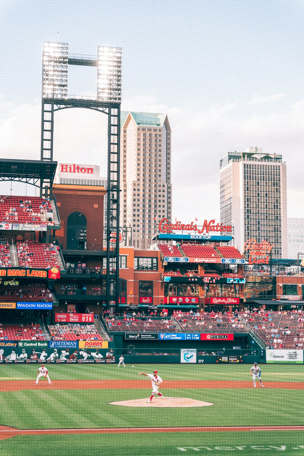 red and white stadium in city during daytime