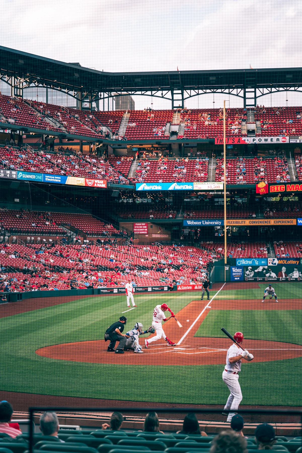 Fans watching a baseball game from the stands