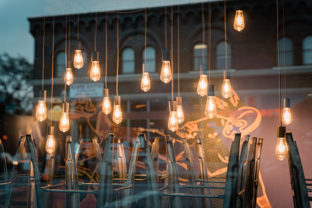 clear glass pendant lamps turned on during nighttime