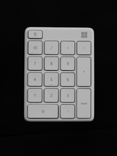 A sleek, modern calculator interface with clear numeric buttons and a minimalist design.