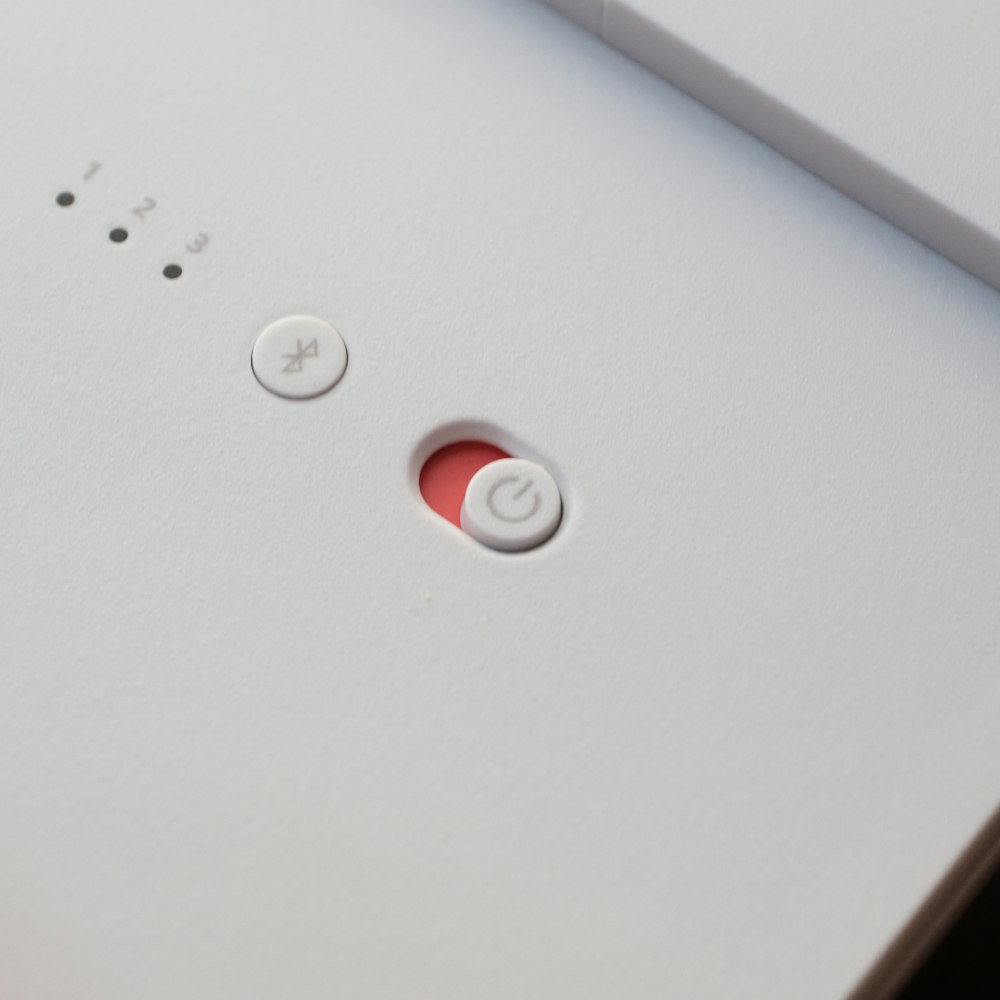 white and red round device