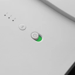 green light bulb on white surface