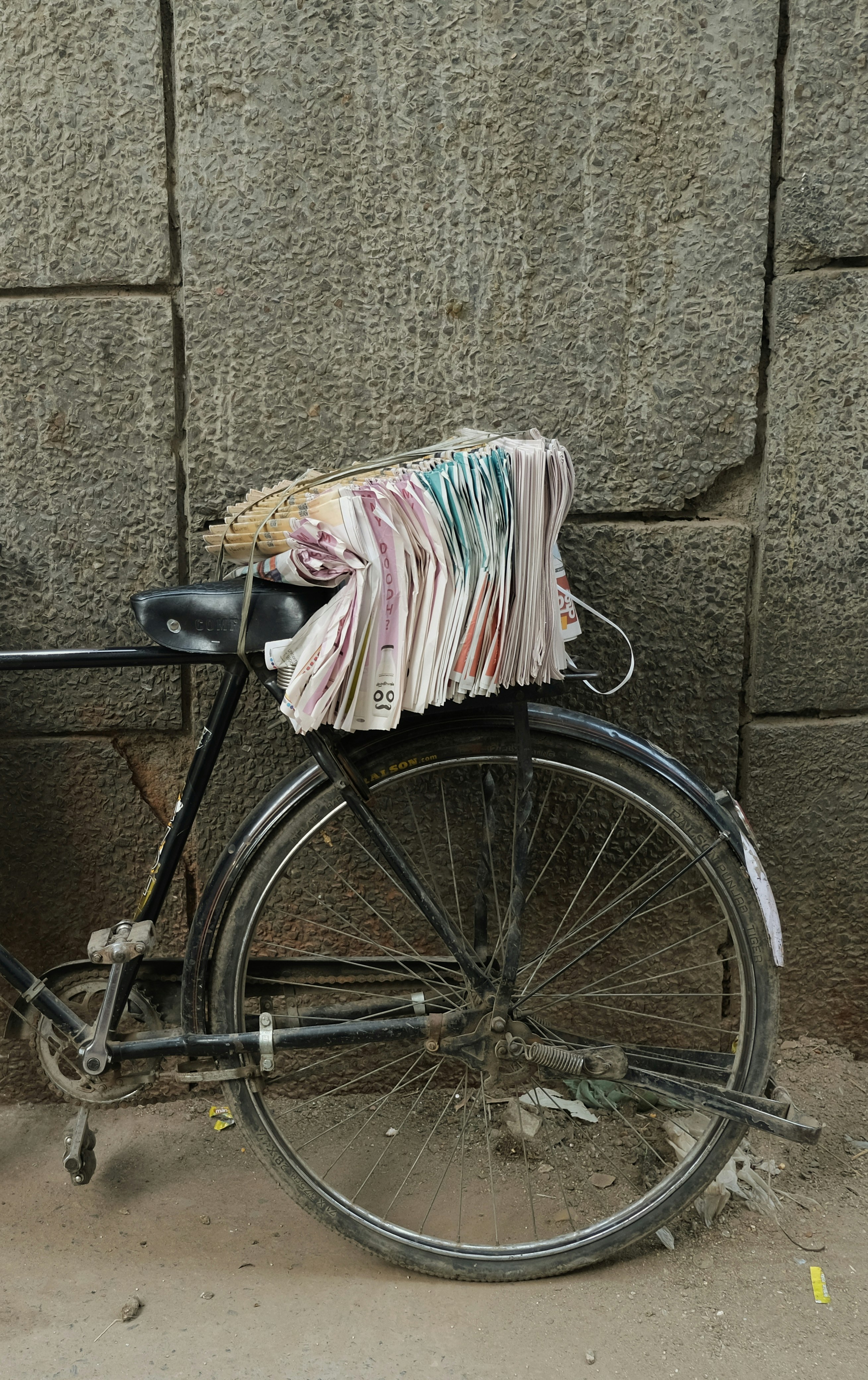 black bicycle with white and pink textile on it