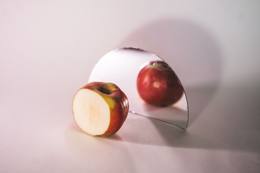 white and red egg on white table