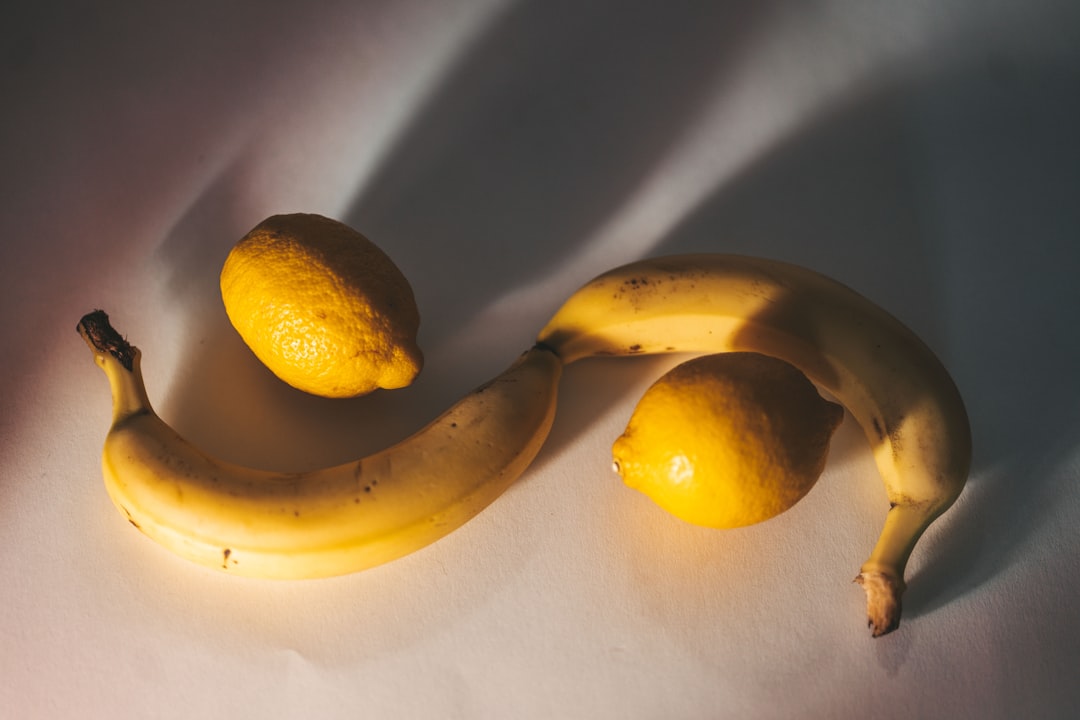 yellow lemon fruit beside yellow lemon