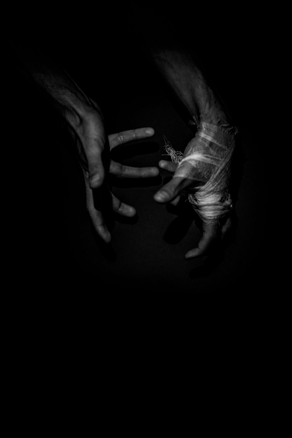 grayscale photo of persons hands