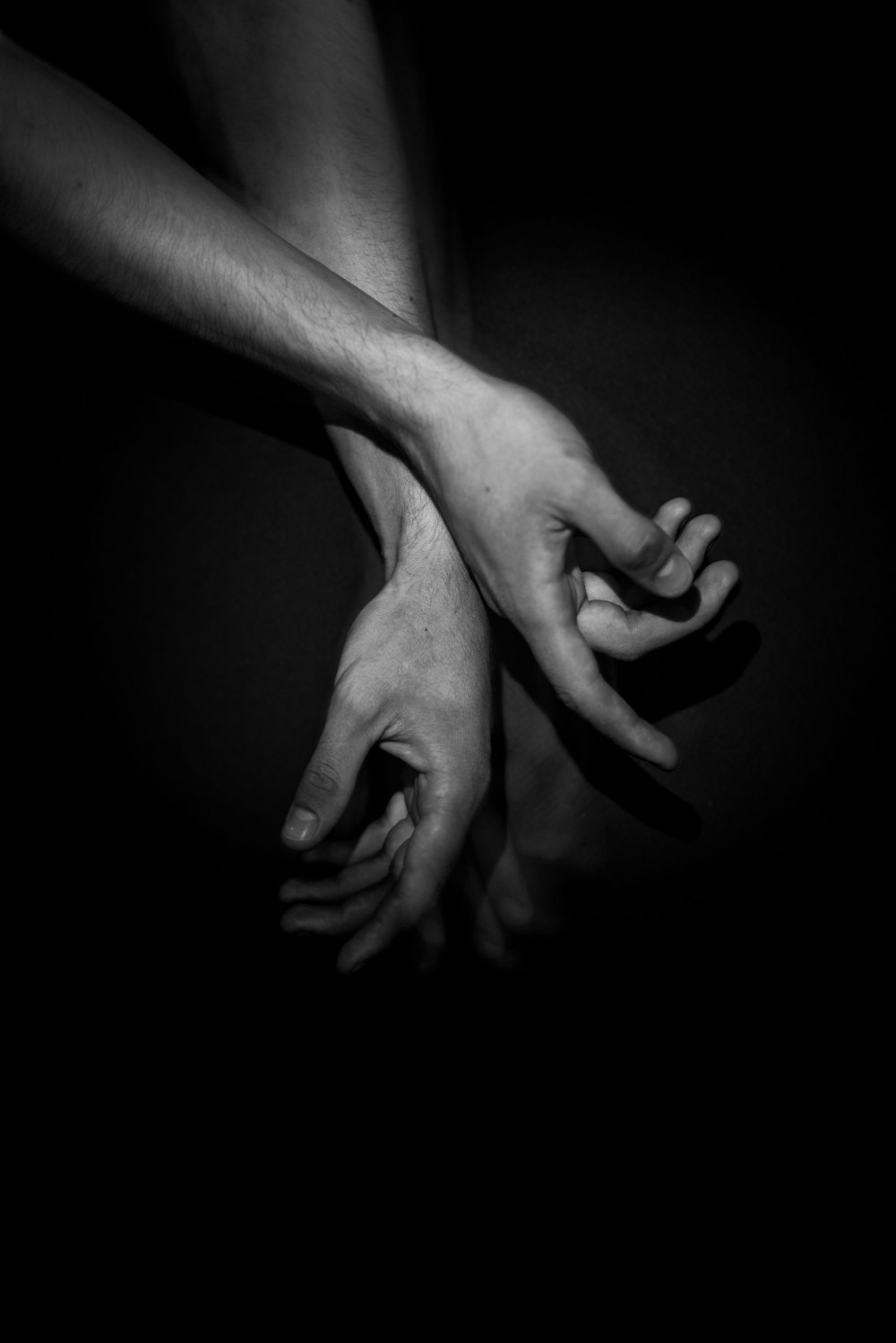 grayscale photo of 2 hands