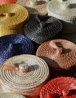 A collection of modern plastic laundry baskets in soft neutral colors.