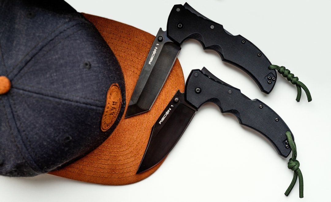 black and silver knife on brown wooden table