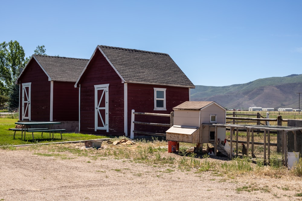 brown wooden house on green grass field during daytime