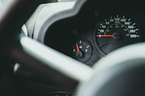 Close-up of a fuel gauge with digital monitoring overlay on a truck dashboard.