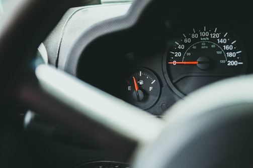 A close-up of a fuel gauge showing optimal levels.