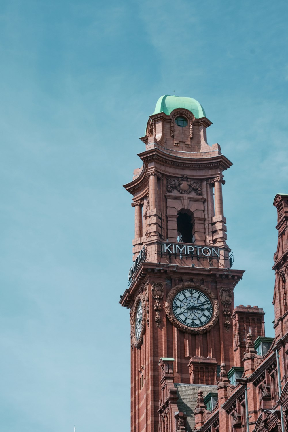 brown and green tower clock