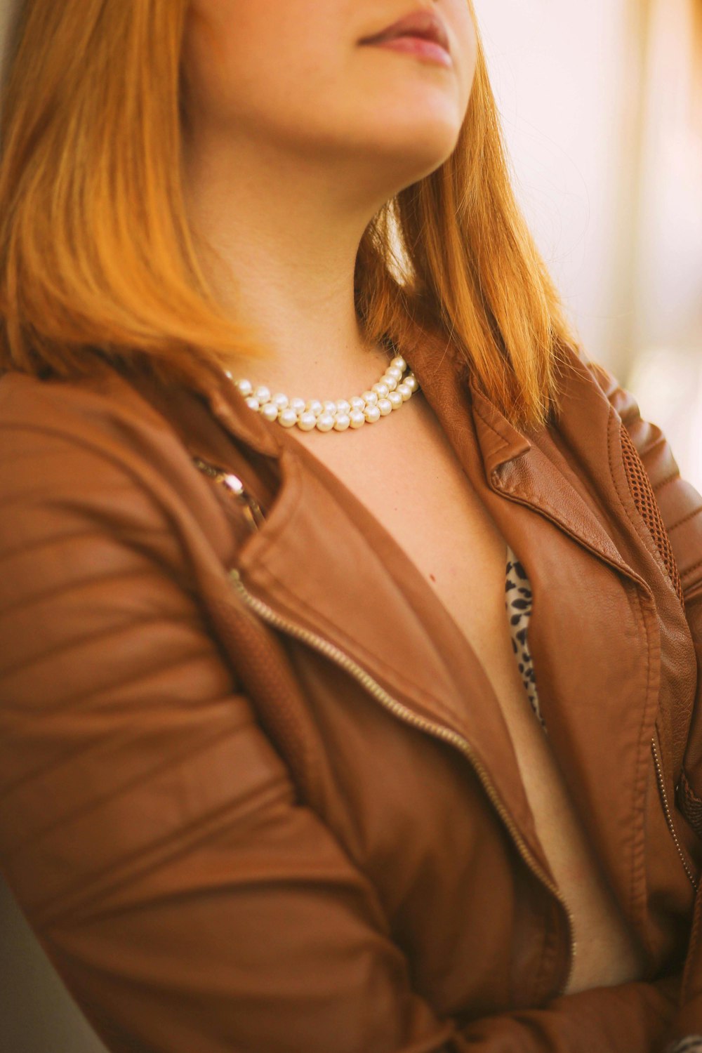 woman in brown leather jacket