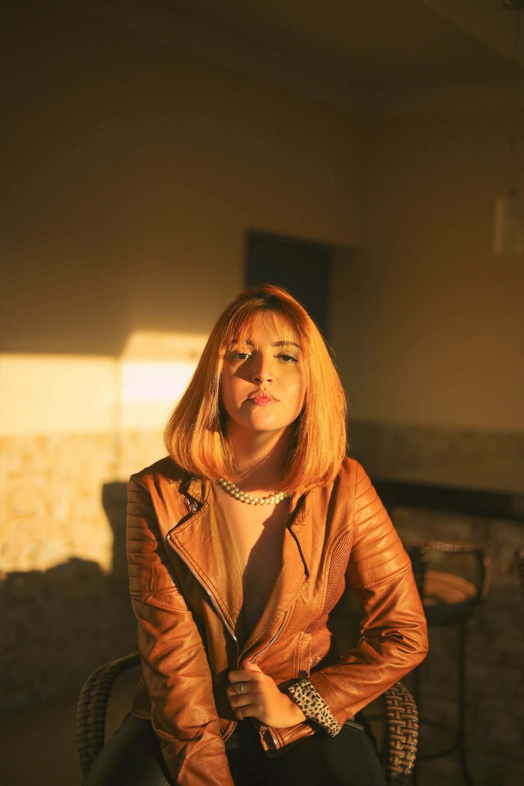 woman in brown leather jacket