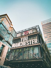 low angle photography of brown concrete building under white sky during daytime