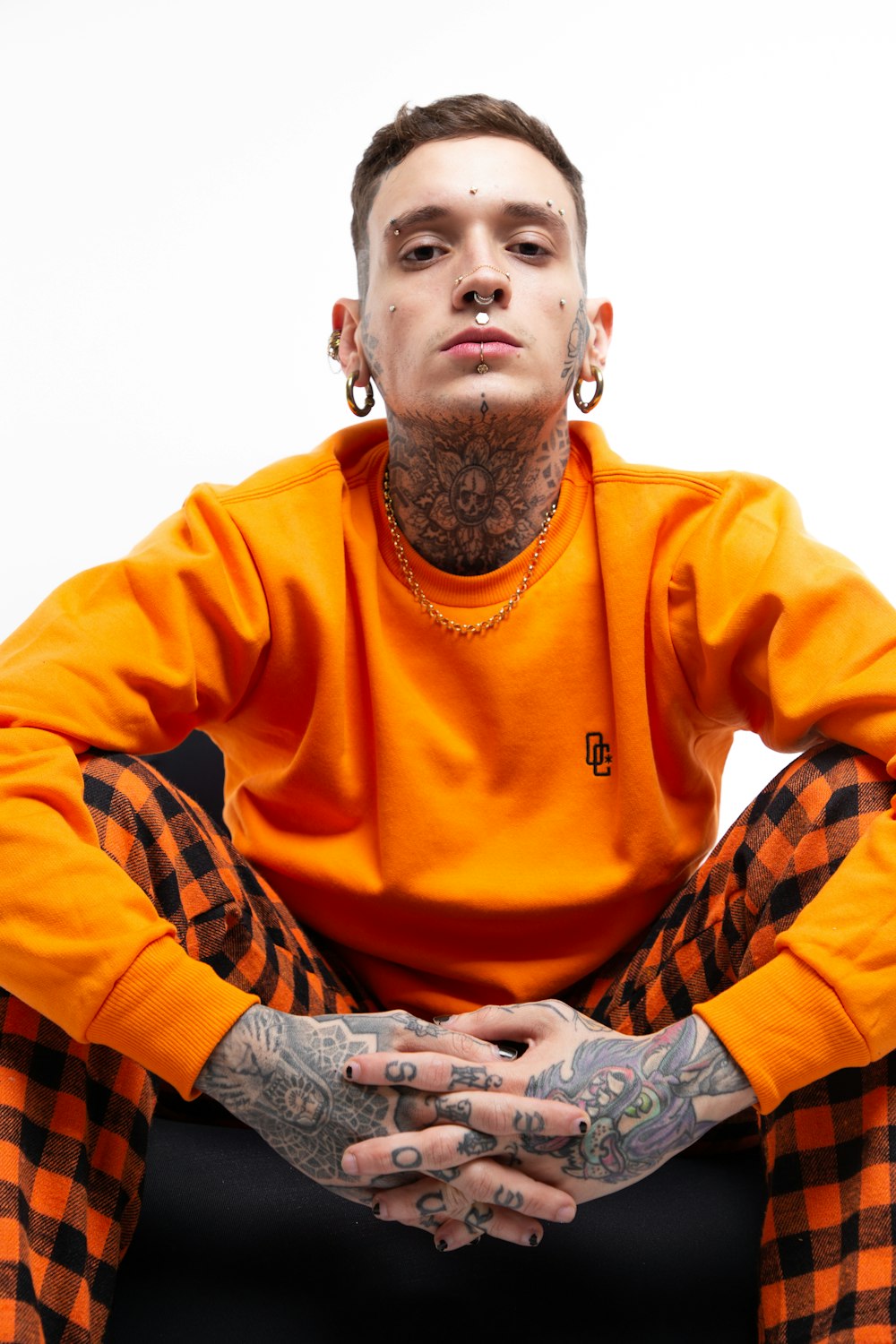 man in orange long sleeve shirt