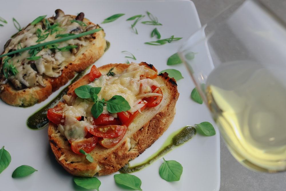 bread with tomato and cheese on white ceramic plate