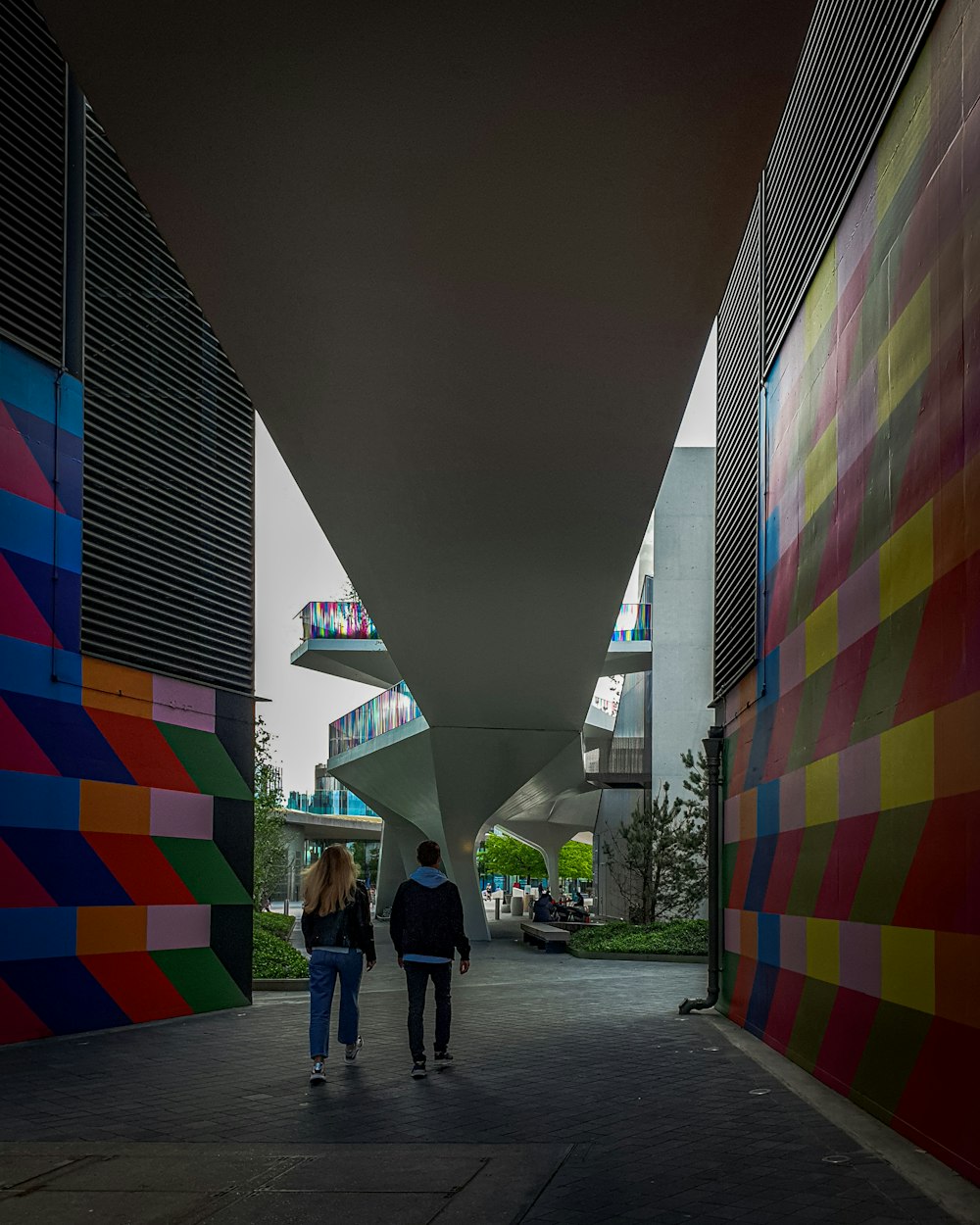 people walking on sidewalk near building during daytime