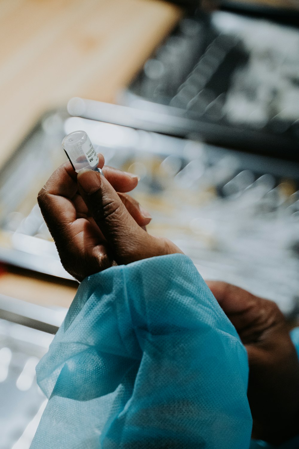 person holding white card on selective focus photography