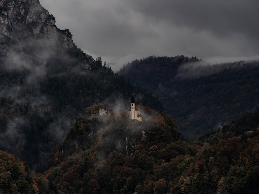 white concrete building on top of mountain