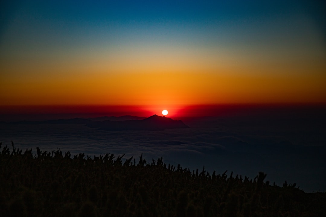 silhouette of mountain during sunset