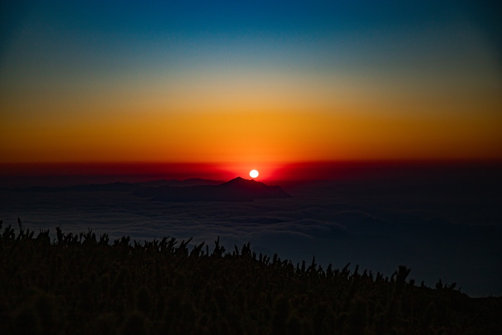 silhouette of mountain during sunset