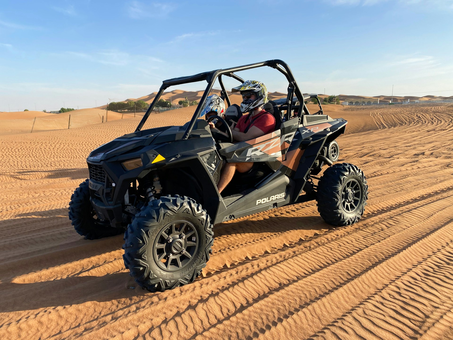 black and blue jeep wrangler on desert during daytime