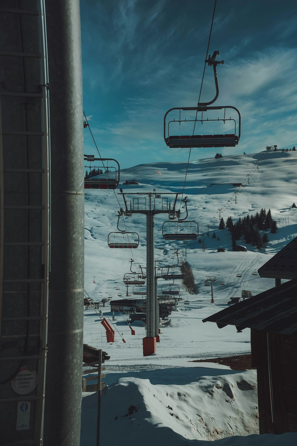 cable cars over snow covered ground during daytime