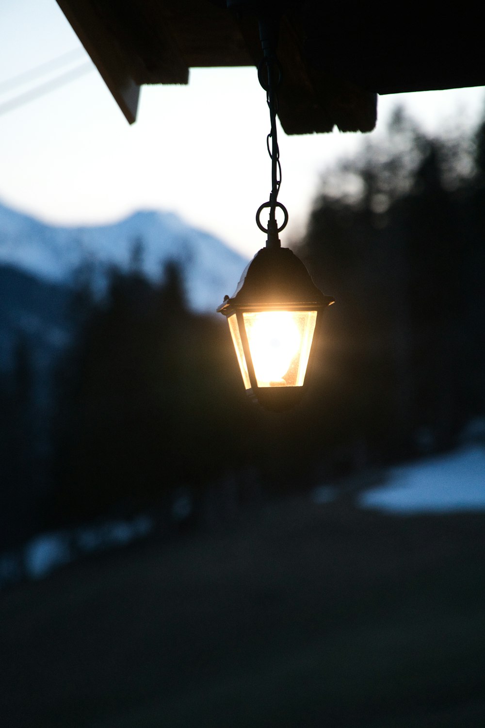 selective focus photography of hanging lamp