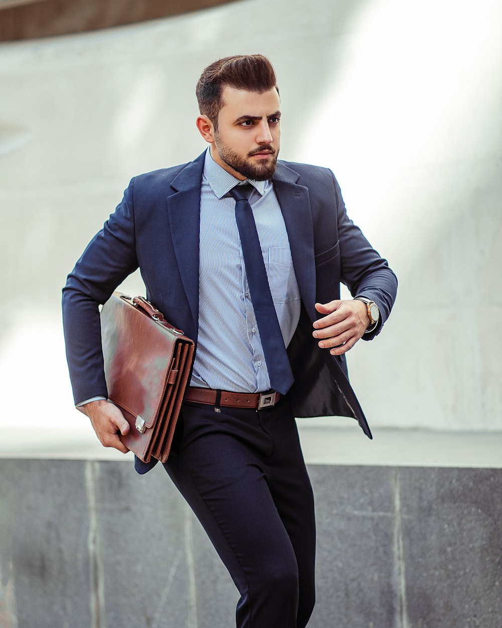Man in blue suit jacket and black pants holding brown leather bag photo –  Free استان تهران، ایران Image on Unsplash
