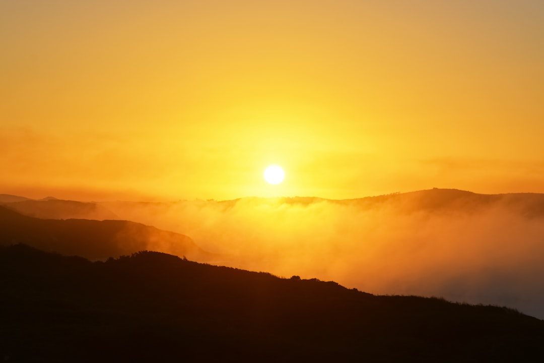 sun setting over the mountains