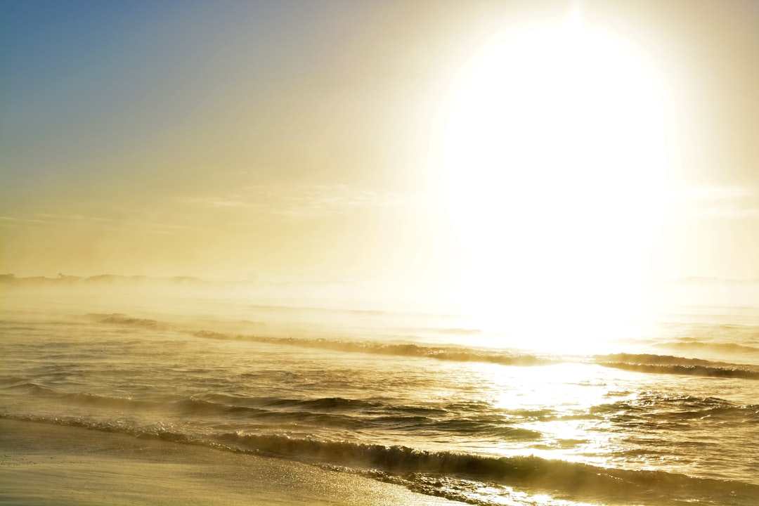 ocean waves crashing on shore during daytime