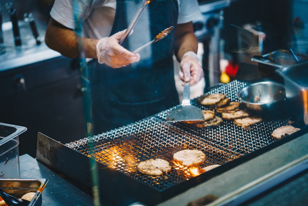 person cooking on black pan