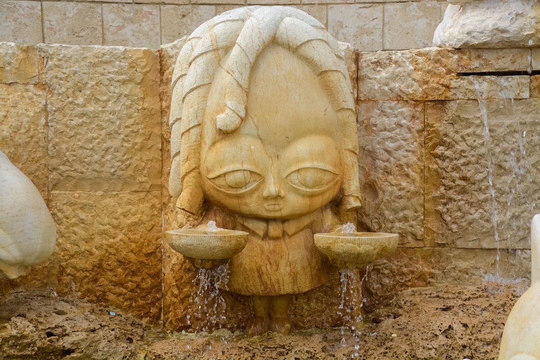 brown concrete statue fountain during daytime