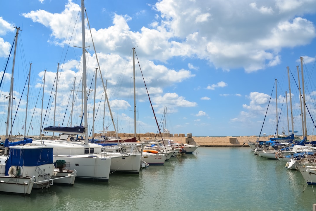 white yacht on body of water during daytime