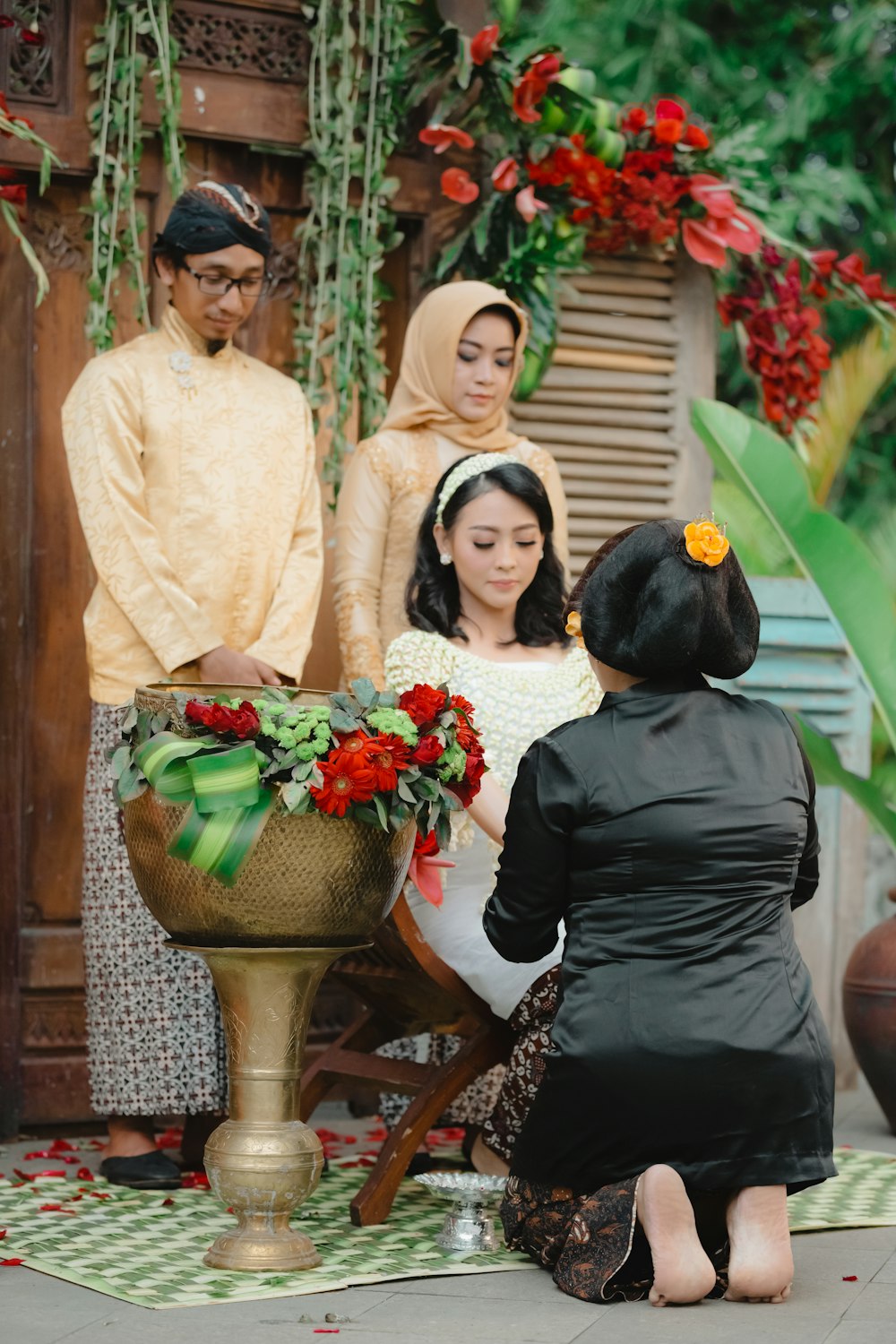 3 women standing beside brown wooden table