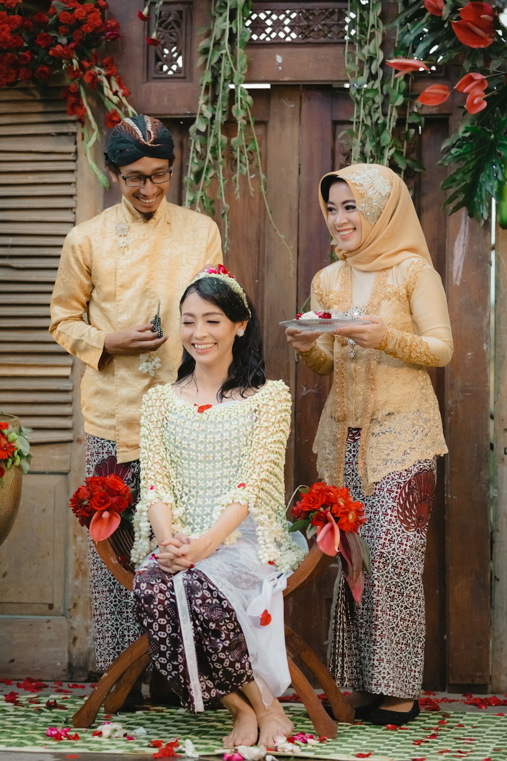 woman in yellow long sleeve shirt beside woman in white and red floral dress