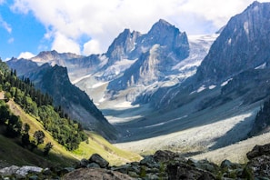 green and gray mountains under white clouds during daytime